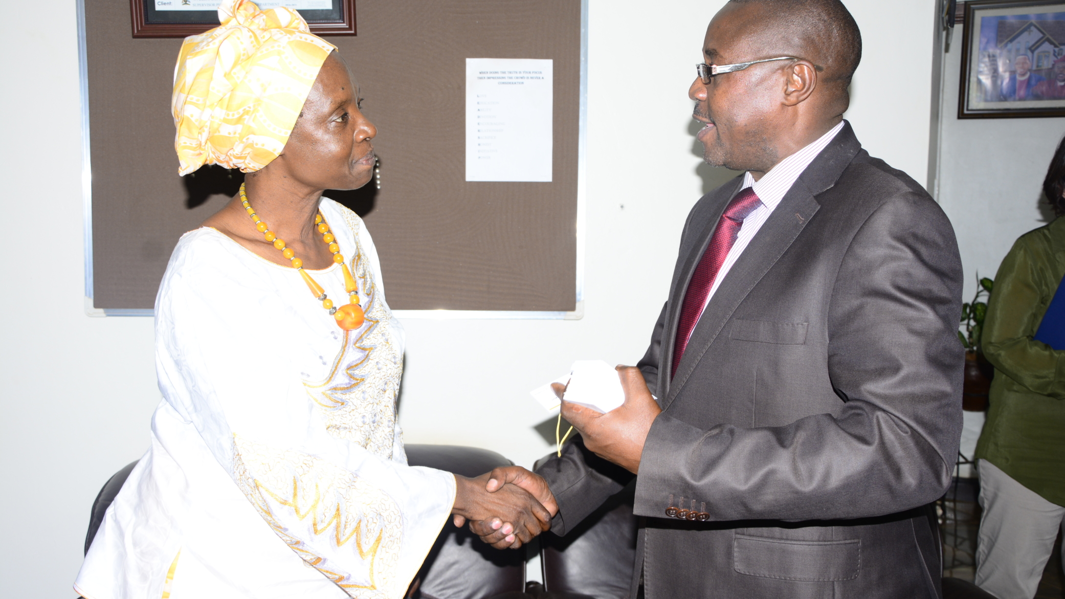 ACODE Acting Board Chair Josephine Odera with Wakiso district chairman Matia Lwanga Bwanika.