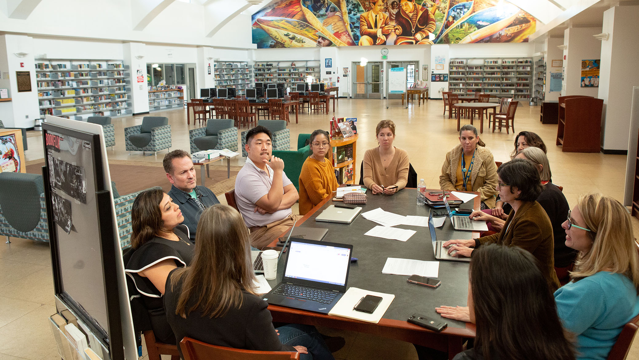 Teachers and staff from UCLA Community School meet with UCLA professors to discuss the various research projects happening at the school.