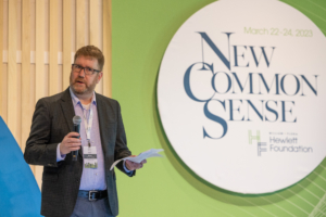 Economy + Society Initiative Director Brian Kettenring on stage at the inaugural New Common Sense media roundtable.